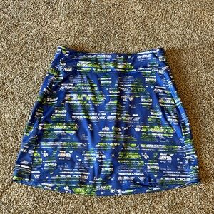 Callaway Skort Size Small in EUC. The colors are periwinkle lime Green and white